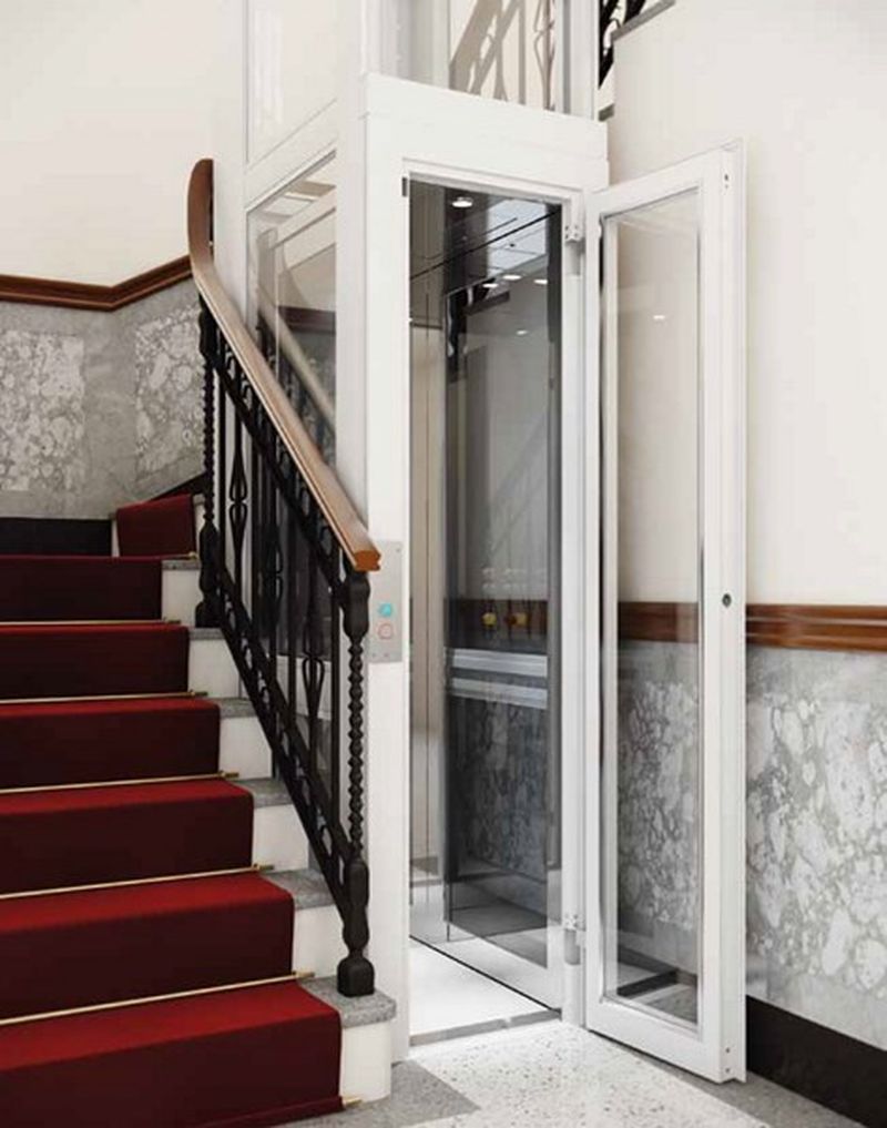 Mini ascenseur pour cage d'escalier en structure vitrée laqué RAL blanc