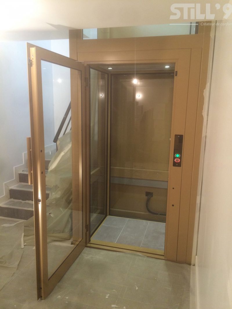 Fixation d'un ascenseur intérieur vitré dans les environs de la Garenne-Colombes 92